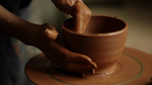 Girl Shaping Clay Product in Pottery