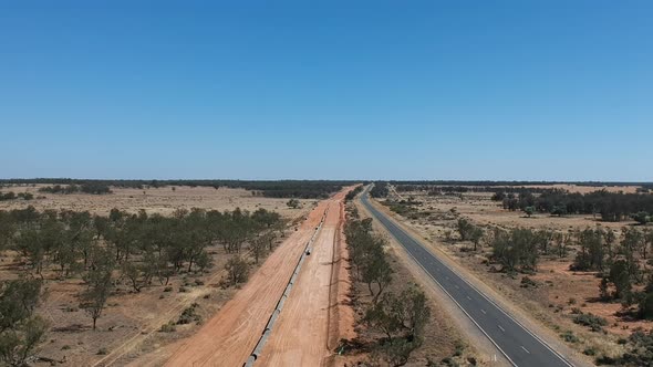 A huge water pipeline being constructed through the desert