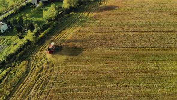 High Viewing Angle of the Harvester Working in the Field. The Concept of the Agricultural Harvest