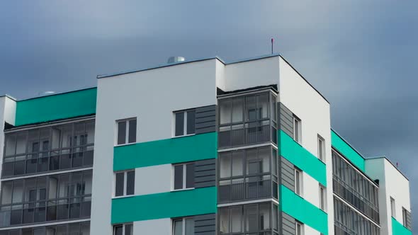 Aerial View of a Residential Building Against the Backdrop of an Urban Landscape