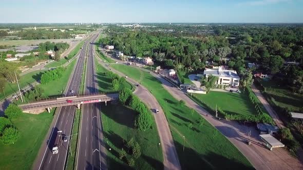 Aerial Drone Scene of City Traffic. Cars and Trucks Movement are Filmed. Aerial Highway