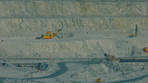 Huge Excavators Machinery Operate on Asbestos Quarry Ledges