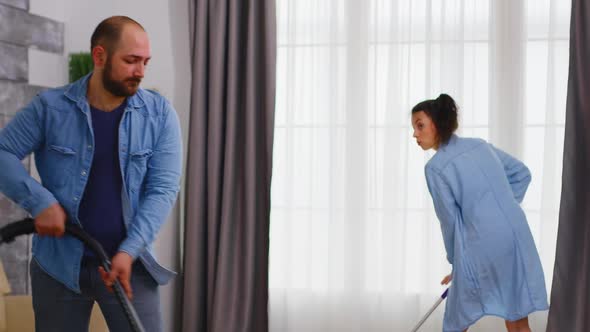 Man Using Vacuum Cleaner