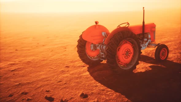 Vintage Retro Tractor on a Farm in Desert