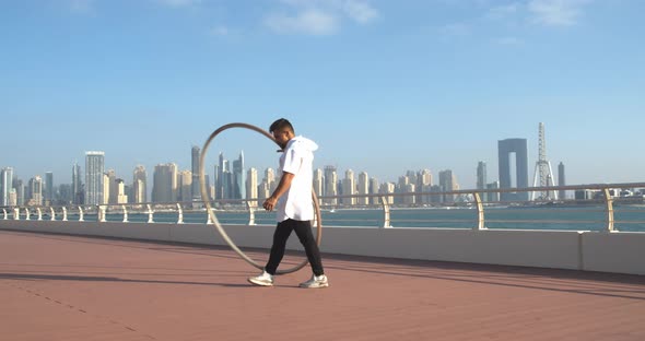 Beautiful View on Dubai Marina and Ain Dubai in the Background of a Gymnast