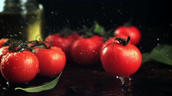 The Tomato Falls on the Table with Drops of Water