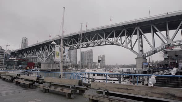 Wide shot of Granville island bridge and Yaletown on cloudy day