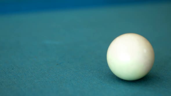 Ball being shot while playing pool