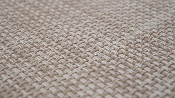 Plastic checkered wicker kitchen mat with beige geometric pattern
