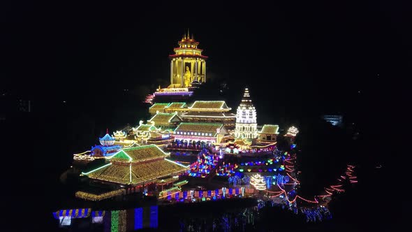 Drone shot Night view of Kek Lok Si temple with colorful beautiful light.