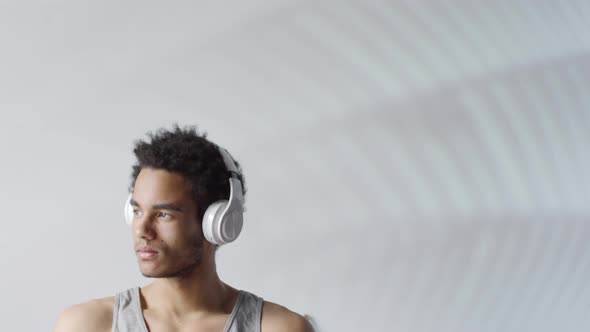 Portrait of Black Man in Wireless Headphones