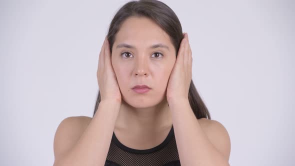 Young Multi-ethnic Woman Covering Ears As Three Wise Monkeys Concept