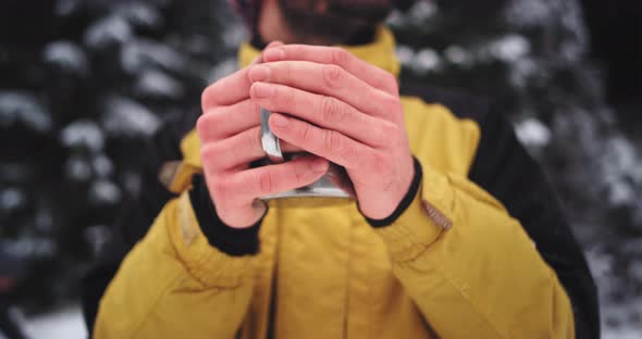 Details Closeup of Frozen Hands of a Tourist in