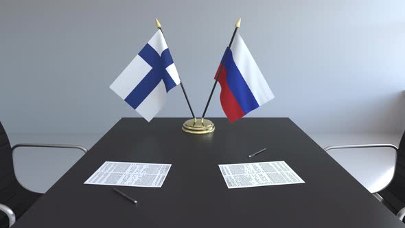 Flags of Finland and Russia on the Table alt