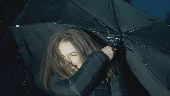 Lady in Jacket Smiles at Heavy Rain in Evening Slow Motion