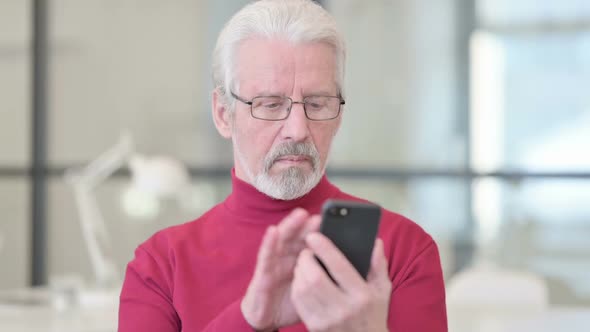 Old Man Using Smartphone