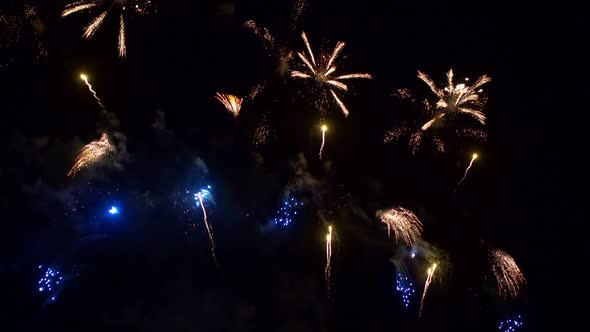 Colorful Firework display at night on sky background