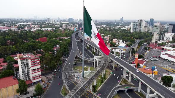 View of Mexico Flag over periferico in mexico city