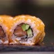 Fresh Sushi Rolls Rotating on Black Stone Slate Plate - VideoHive Item for Sale