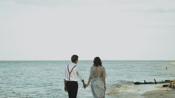 Happy Couple Together Walking Through the Beach Side They Feeling Great and Very Romantic Holding