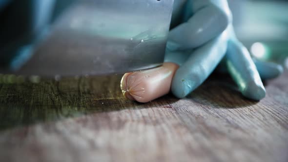 Restaurant Menus, Cook with Gloves Cuts a Sausage with a Knife To Prepare Dishes in Restaurants