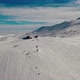 Aerial View Snow Mountain Peak Clouds in Background  Winter Drone Footage Ski Resort - VideoHive Item for Sale