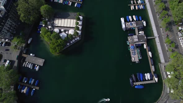 Scenic aerial view of Zurich, Switzerland. Drone tilt-up reveal shot of Limmat river and city.