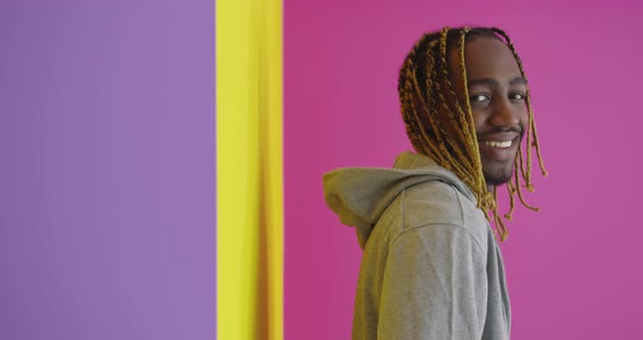 Portrait of Young AfroAmerican Male Over Color Background