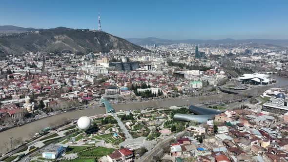 Aerial view of center of Tbilisi under Mtatsminda mountain, Georgia 2022 spring