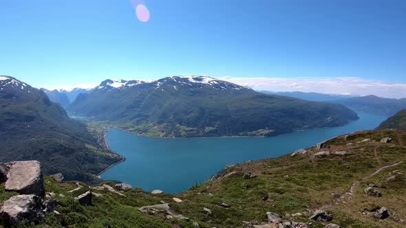 Panoramic timelapse showing Olden and Innvikfjord seen from mountain Hoven and Loen Skylift restaura