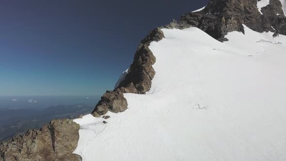 Majestic Drone View of Snow Capped Peaks in Switzerland