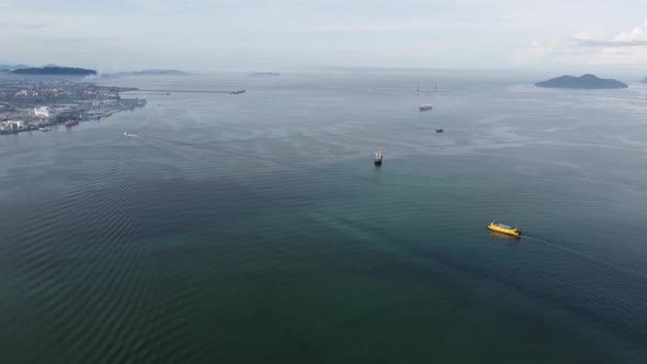 Aerial view yellow roro ferry move at Penang sea