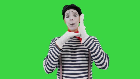 Mime Performing Like He Is Drowning on a Green Screen Chroma Key