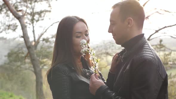 Loving Young Couple Kissing in the Park They are Happy Together