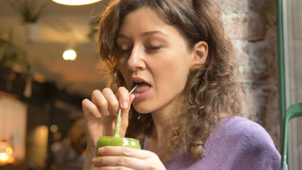 Woman Sips Delicious Vegetarian Fresh Holding Metal Straw