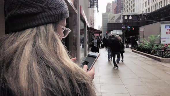 Close Up Shot of a Young Woman Using her Cell Phone in Downtown Chicago