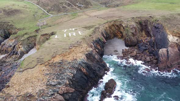 Flying Over the Coastline of the Wild Atlantic Way By Maghery with the Eire 74 Sign, Dungloe