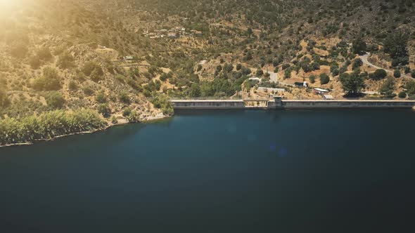 Aerial View Dam on River in Mountains