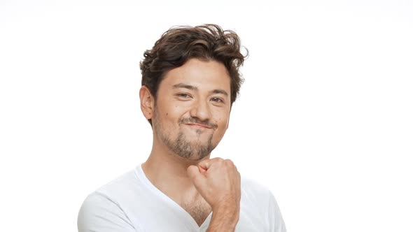 Young Handsome Man Rejoicing Over White Background