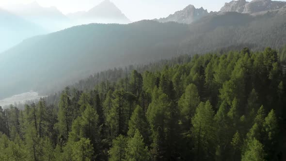 Aerial Flying over Mountain Forest at Croda da Lago in Dolomites Alps Italy