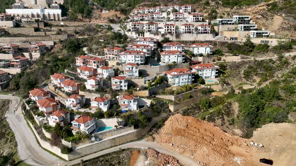 Complex of villas in the mountains aerial view 4 K