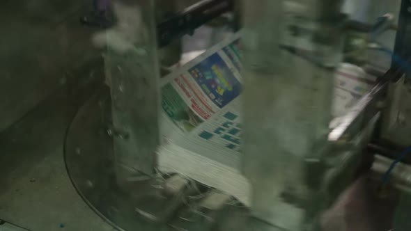 Robot Packs in a Large Stack of Newspapers