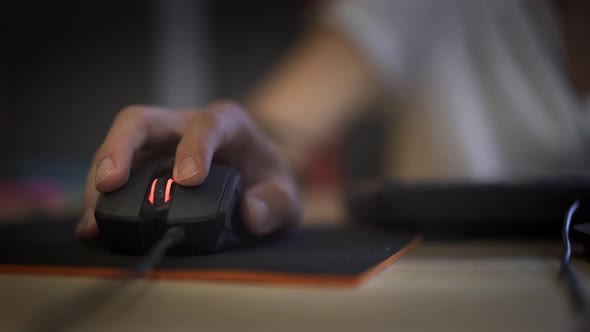 A Man Clicking Digital Mouse and Working on Computer