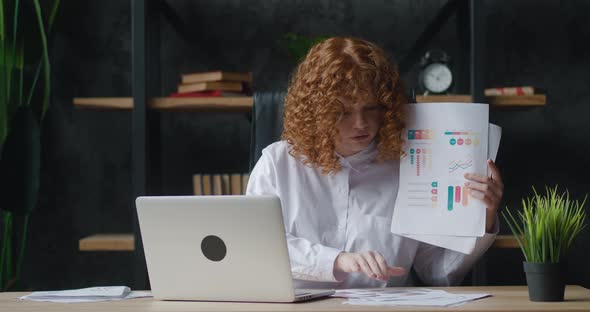 Redhaired Woman with Curly Hair Using Laptop for Remote Video Calling Takes a Part in Virtual