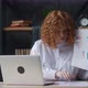 Redhaired Woman with Curly Hair Using Laptop for Remote Video Calling Takes a Part in Virtual - VideoHive Item for Sale