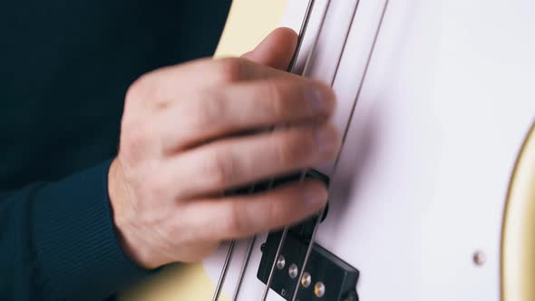 Guitarist Performs Backbeat Technique on Bass Guitar