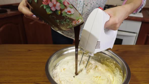 Adding chocolate into the cream filling