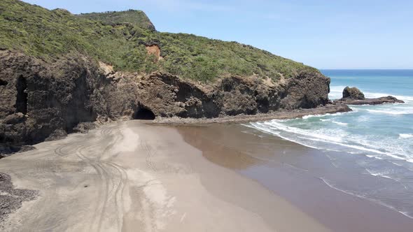 Scenic Beach With Tourist Walking On The Sandy Shore At Bethells Beach, Auckland, North Island, New