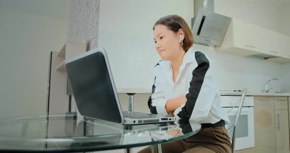 Manager Talks To Colleagues During Online Conference at Home