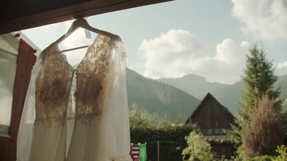 Bride dress on display outside.